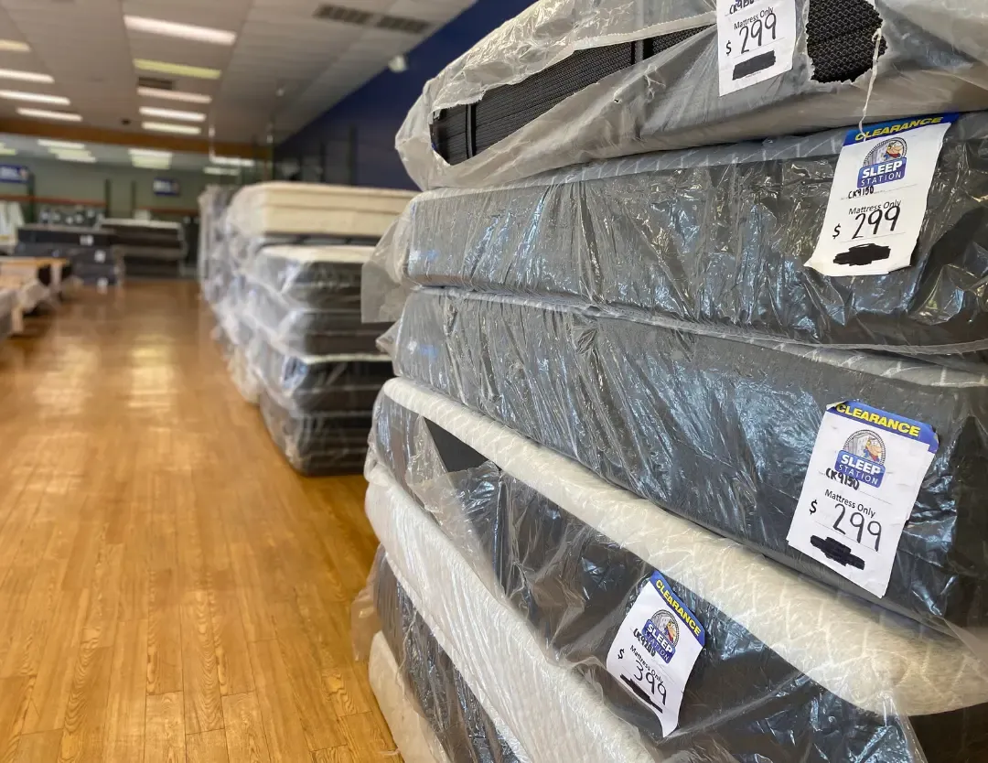 Stack of mattresses at an angle.